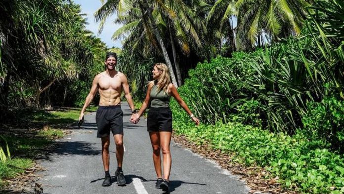 World-traveling couple walks across 'least-visited country' in under 60 seconds