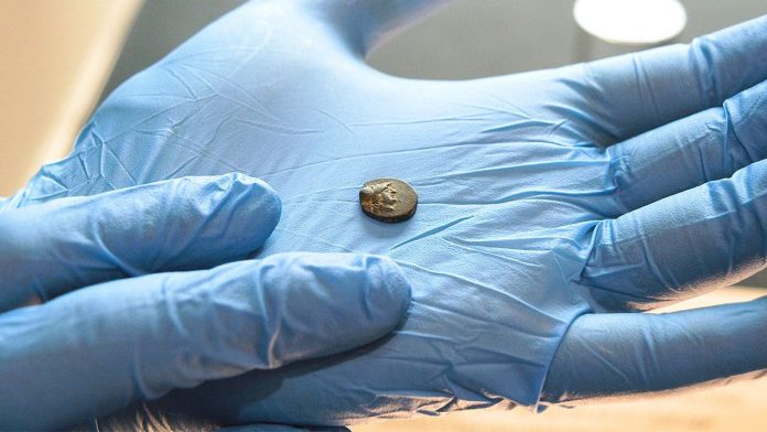 Teen stumbles on mysterious coin from legendary city, puzzling archaeologists over its journey