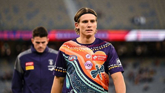 Fremantle star Caleb Serong called out for ‘bizarre’ decision to travel to Brisbane while injured